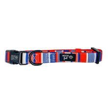 Load image into Gallery viewer, Showcaing flat lay Red, Blue and White stripped pattern Dog Collar with metal D ring in black colour from Woof First