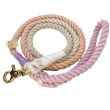 Load image into Gallery viewer, The image shown is of the Dogs Rope leash in 3 blended colours of grey, pink and purple. The rope leash has gold metal hardware finishes and has Woof First imprinted on a round charm.