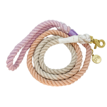 Load image into Gallery viewer, The image shown is of the Dogs Rope leash in 3 blended colours of grey, pink and purple. The rope leash has gold metal hardware finishes and has Woof First imprinted on a round charm.