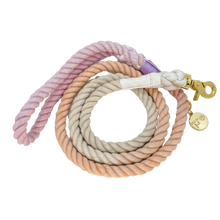 Load image into Gallery viewer, The image shown is of the Dogs Rope leash in 3 blended colours of grey, pink and purple. The rope leash has gold metal hardware finishes and has Woof First imprinted on a round charm.
